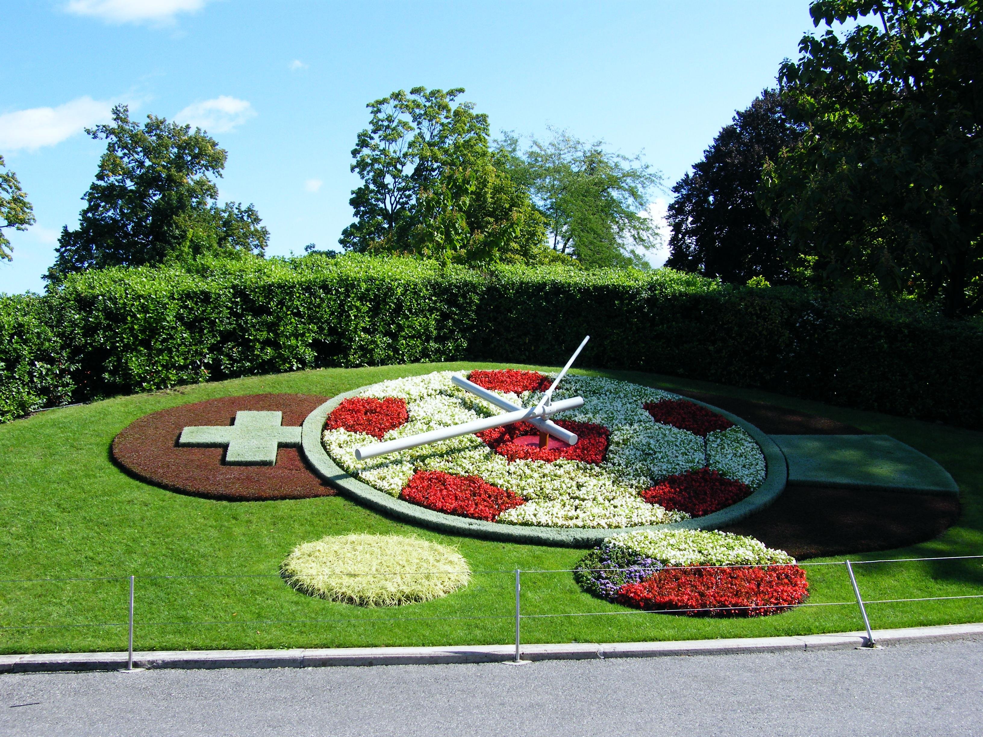 Цветочные часы растений. Швейцария Женева цветочные часы. Цветочные часы английский сад Женева, Швейцария. Женева парк цветочные часы. Цветочные часы Александровский парк.
